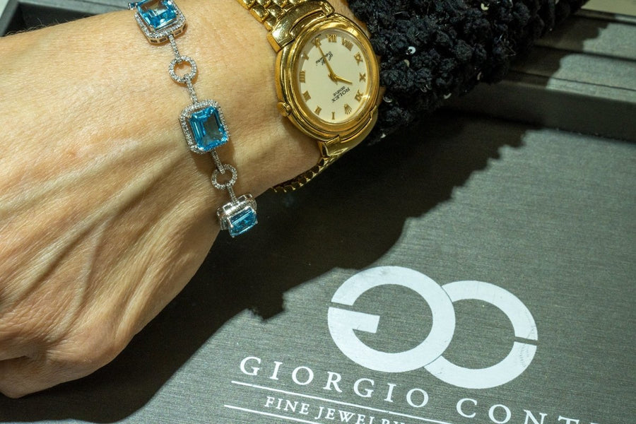 14KT White Gold 24.23CTW Emerald Cut Natural Blue Topaz and Diamond Bracelet - Giorgio Conti Jewelers