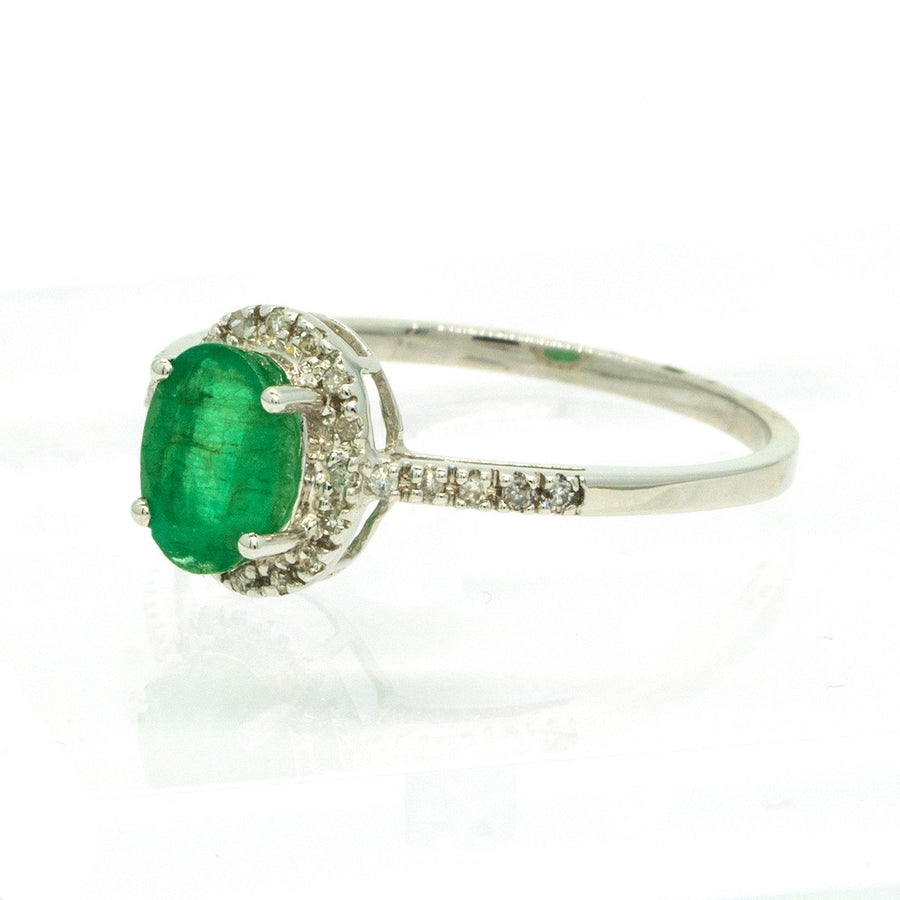 14KT White Gold 1.06ctw Oval Cut Prong Set Emerald And Round Cut Diamond Halo Engagement Ring - Giorgio Conti Jewelers
