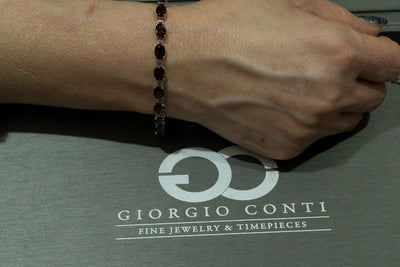 14KT White Gold 18.00CTW Oval Cut Prong Set Natural Red Garnet Tennis Bracelet - Giorgio Conti Jewelers