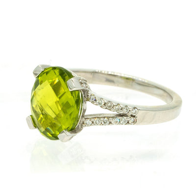 14KT White Gold 3.79ctw Oval Cut Prong Set Peridot And Round Cut Diamond Ring - Giorgio Conti Jewelers