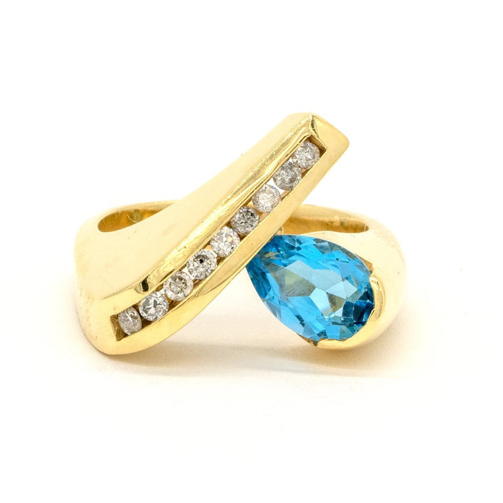 14KT Yellow Gold 1.70CTW Pear Shape Channel Set Blue Topaz and Diamond Ring - Giorgio Conti Jewelers