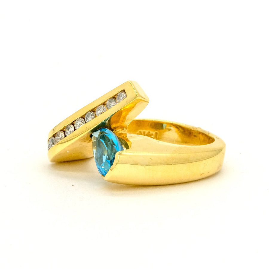 14KT Yellow Gold 1.70CTW Pear Shape Channel Set Blue Topaz and Diamond Ring - Giorgio Conti Jewelers