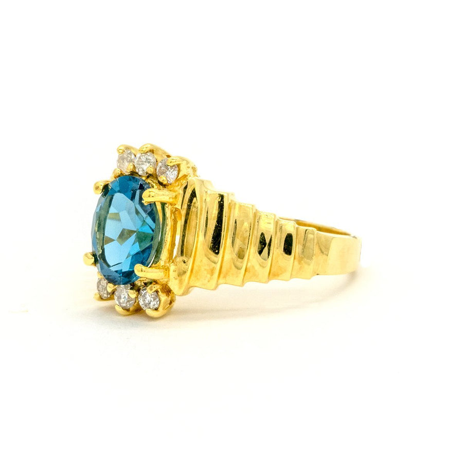 14KT Yellow Gold 1.96CTW Oval Cut Prong Set Blue Topaz and Diamond Ring - Giorgio Conti Jewelers