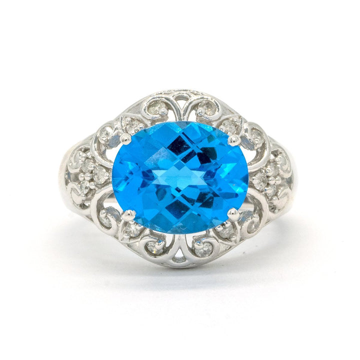 White Gold 6.25CTW Faceted Top Oval Cut Prong Set Natural Blue Topaz and Diamond Ring - Giorgio Conti Jewelers